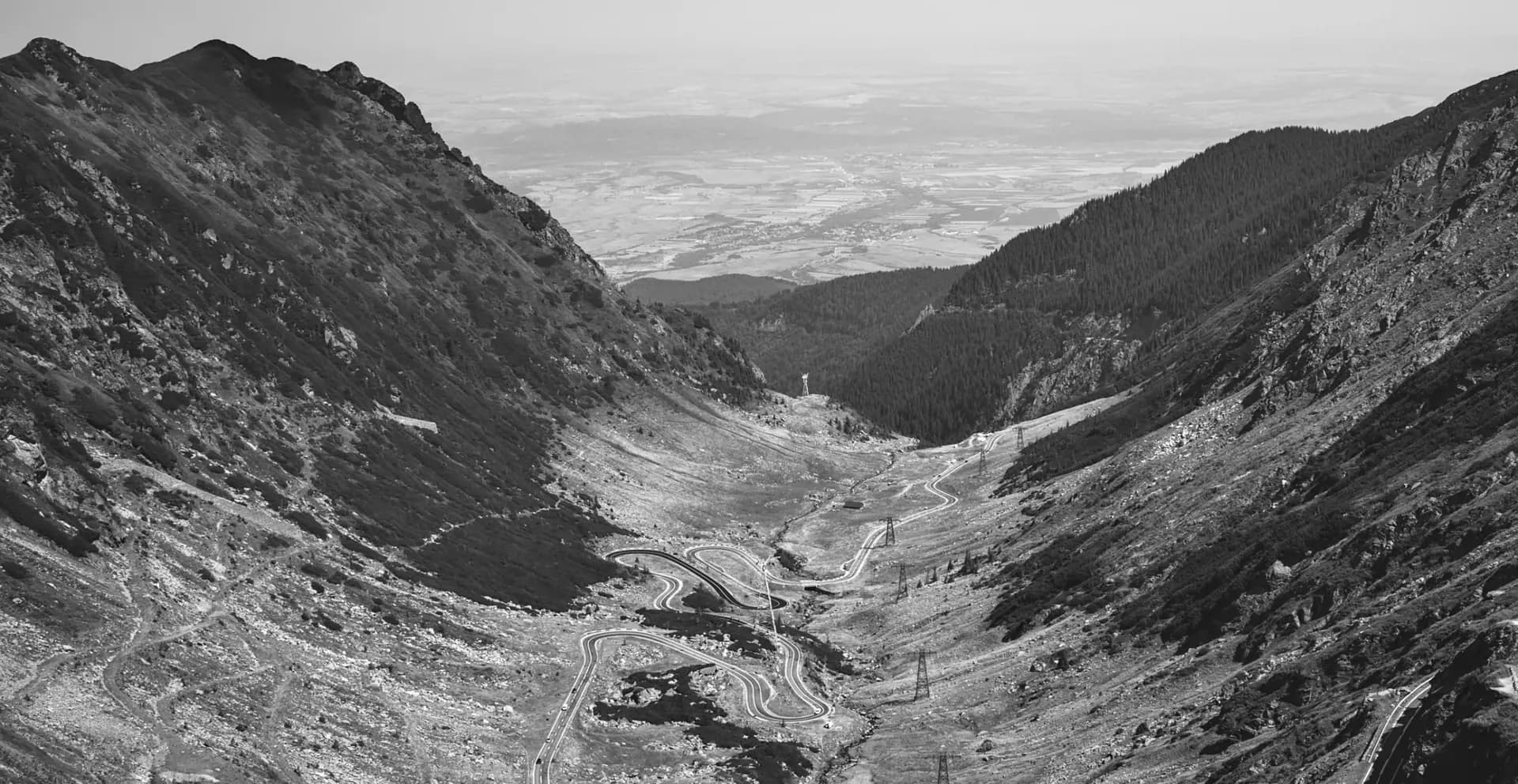 A winding mountain road through the Carpathians, seen from above